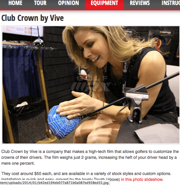 Smiling woman applying design to golf driver